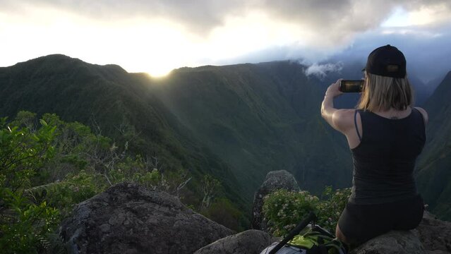 person taking a picture in the mountains