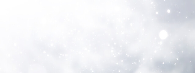 Fototapeta premium blue snowfall bokeh background, abstract snowflake background on blurred abstract blue