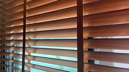 Wooden blinds for windows, material design for interior.