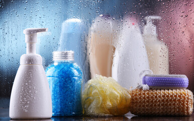 Different containers of body care products in the bathroom