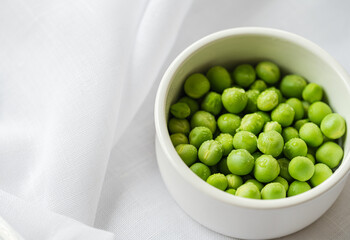 Bowl of organic peas with copy space