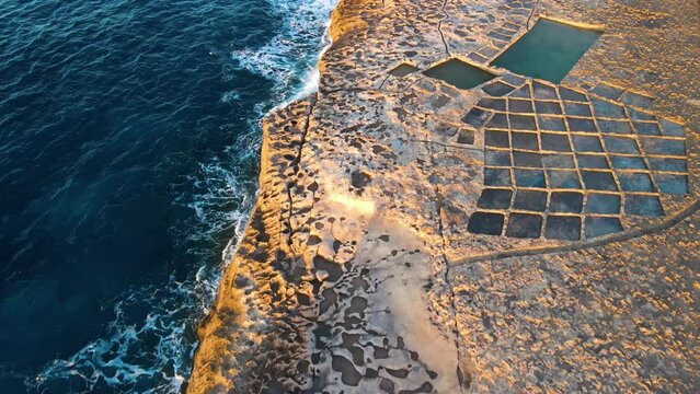 Aerial sunset view of Salt Pans in Zebbug, Gozo
