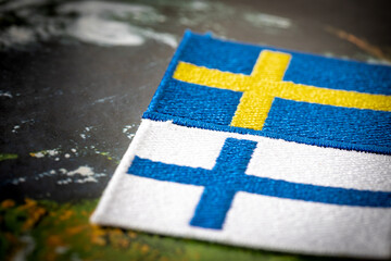 flags of sweden and finland, economic and military pact and cooperation concept - obrazy, fototapety, plakaty