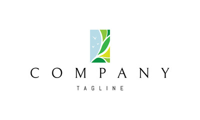 Vector logo on which an abstract image of a tree against the blue sky.