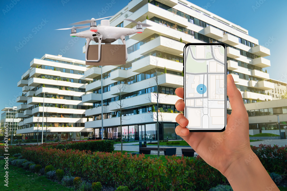 Poster hand with phone on background of delivery drone. on the screen a map with a location marker.