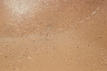 Summer day beach sand texture. Top view, flat lay
