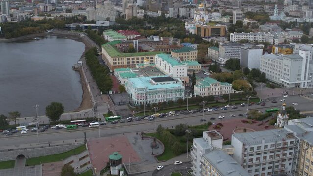 Embankment of the central pond and Plotinka, the historic center of the Yekaterinburg city, Russia. Stock footage. Aerial view of a summer city streets and buildings.