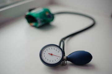 Tonometer on a white background. Diagnostic device for determining blood pressure and pulse rate