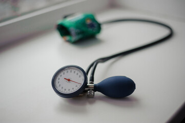 Tonometer on a white background. Diagnostic device for determining blood pressure and pulse rate