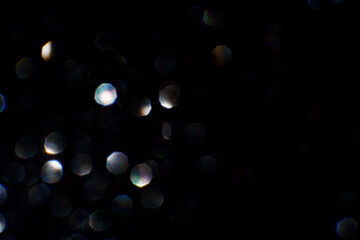 Bokeh circle with silver sparkles background. Grey glitter backdrop. Monochrome texture. New year luxury snow. Copyspace. Shimmer confetti wallpaper. Dreamy shiny design detail. For multiply
