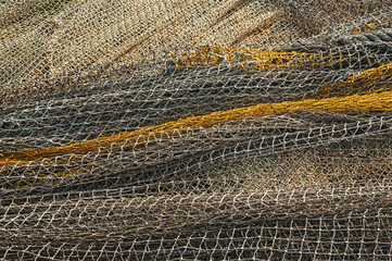  Background of tangled fishing nets, toned.