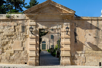 Entrance to an ancient villa with a stonewall door