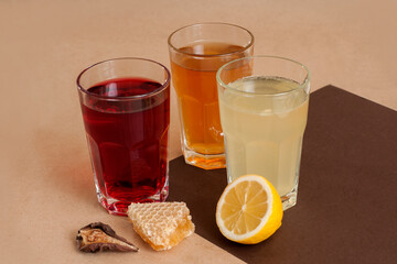 Hot winter drinks with lemon, cinnamon, cardamom and honey. Mulled wine and spices.