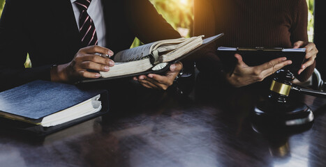 Concepts of Law and Legal services. Lawyer working on table office, law.