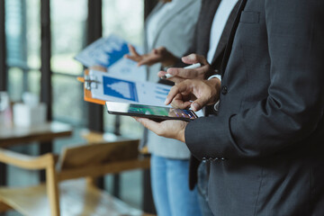 Selective focus hands of business team meeting and working together with customer connection in the office, Business new start up and Modern technologies for connection concept.