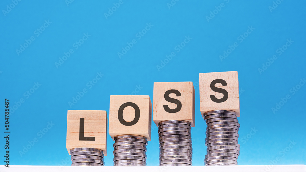 Poster loss - text on wood cube block stack with coins