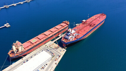 Aerial drone top view photo of industrial crude oil container tanker anchored in Mediterranean port