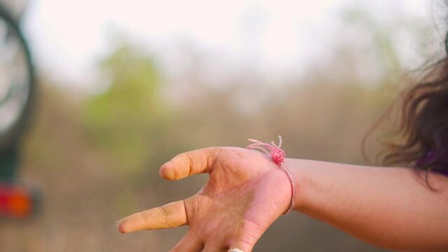 Close up shot of woman releasing soil from hand. Concept of save the soil and environment conservation. Forest land soil. Agriculture, gardening or ecology concept