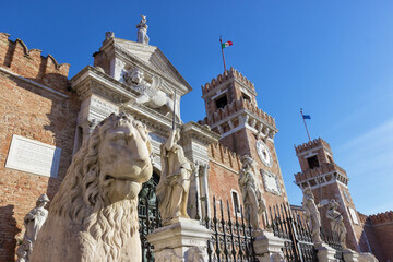 Bottom view of the arsenal of Venice with lion statue in the foreground