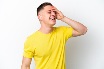 Young brazilian man isolated on white background smiling a lot