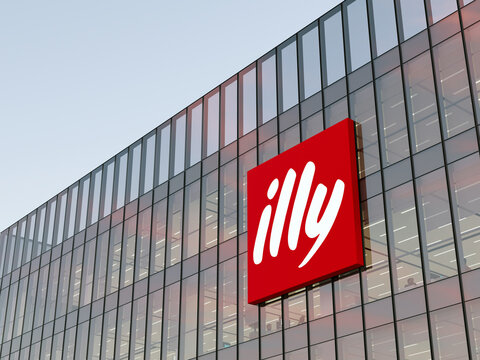 Trieste, Italy. May 2, 2022. Editorial Use Only, 3D CGI. Illy Corporation Signage Logo on Top of Glass Building. Workplace Coffee Company Office Headquarters.