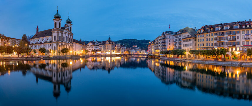 Lucerne (Luzern) city panorama at night with view of Jesuit church and Reuss River, Switzerland