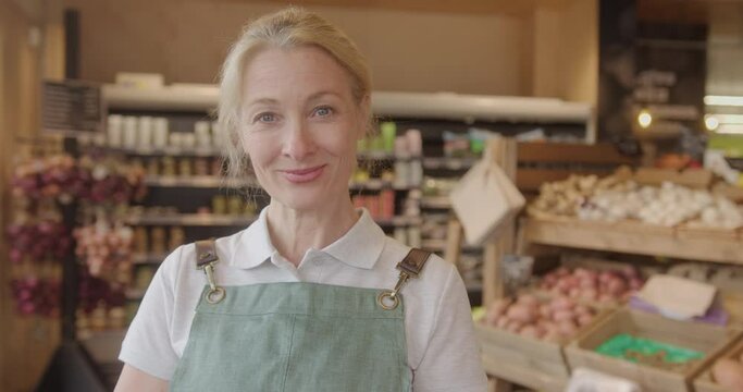 Portrait of Supermarket Employee Looking at Camera
