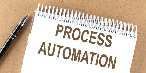 PROCESS AUTOMATION text on a notepad with pen, business