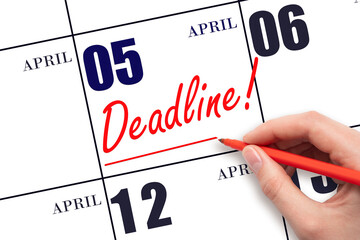 Hand drawing red line and writing the text Deadline on calendar date April 5. Deadline word written on calendar