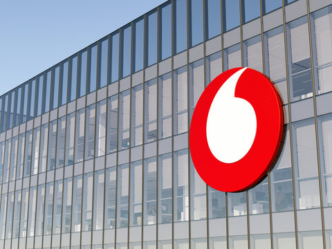 Berkshire, United Kingdom. May 2, 2022. Editorial Use Only, 3D CGI. Vodafone Group Signage Logo on Top of Glass Building. Multinational Mobile Carrier Company Office Headquarters.