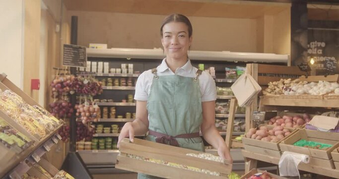 Portrait of Supermarket Employee Looking at Camera
