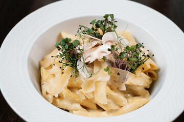 Pasta with mushrooms. Traditional Italian dish.