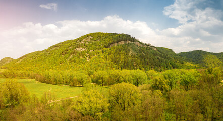Obraz premium Aerial ecological background with forest covered hills and mountains