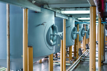 Valves on sides of sand and coal filtration columns at plant