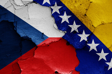 flags of Czechia and Bosnia and Herzegovina painted on cracked wall