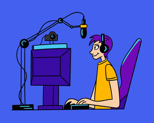 Game streamer sits at the computer and shoots video on the camera