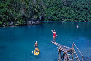 Sugba lagoon, tourists attraction. SUP Stand up paddle board. Blue sea lagoon, National Park,...