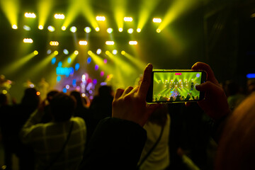 Hands with phones on concert, atmosphere on concert