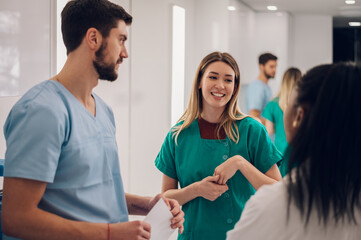 Multiracial team of doctors discussing a patients condition while working in a hospital