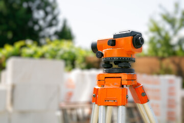 Surveyor equipment tacheometer or theodolite outdoors at construction site. Copy space. Close-up....