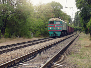 Naklejka premium Freight train approaches to the station. Mariupol.