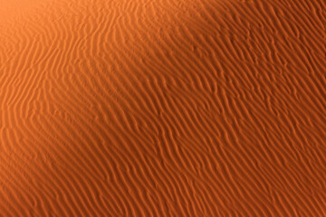 A pattern formed in the sand by desert winds