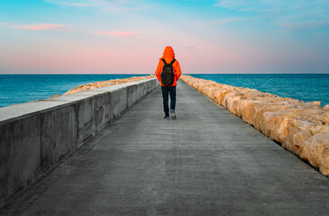 Man walking on pier