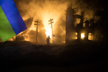 Silhouette soldier carrying little boy on his shoulder from fire. Rescue savior concept. Man moving...
