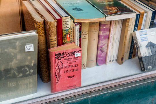 Second hand vintage books in French language in a bookshop window in Geneva, Switzerland