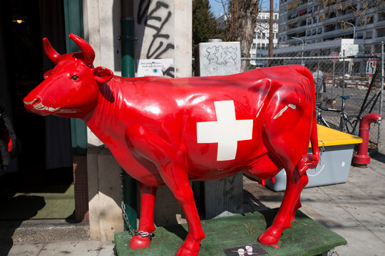 Red cow figurine with Swiss flag in Geneva, Switzerland