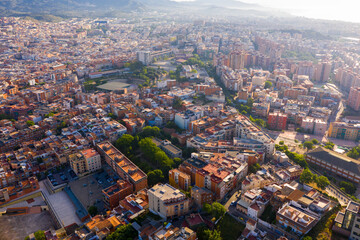 Aerial view of Santa Coloma de Gramenet with a apartment buildings and Besos river, Spain