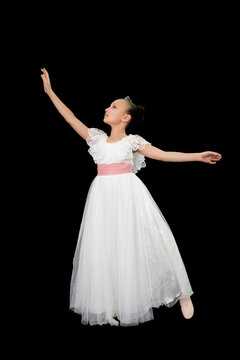 Girl ballet dancer in white long dress theatrical dancing on black background. Full length, studio shot. Part of photo series