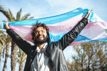 Pride trans person with transgender flag - obrazy, fototapety, plakaty