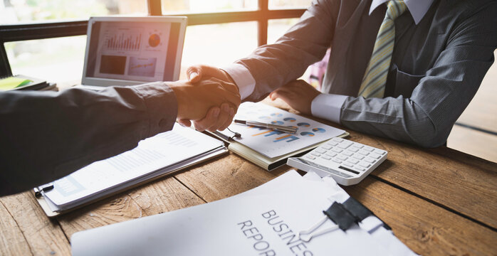 Business people shaking hands together, Business partnership handshake concept.Photo two coworkers handshaking process.Successful deal after great meeting